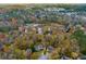 Aerial view of neighborhood with lake and trees at 3799 Halisport Nw Ln, Kennesaw, GA 30152