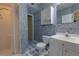 Clean bathroom with shower, toilet, vanity, and storage at 3799 Halisport Nw Ln, Kennesaw, GA 30152