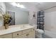 Clean bathroom with a tub shower, toilet, and vanity at 3799 Halisport Nw Ln, Kennesaw, GA 30152