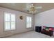 Well lit bedroom with two windows and a ceiling fan at 3799 Halisport Nw Ln, Kennesaw, GA 30152