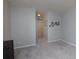 Spacious bedroom with gray walls and carpet, featuring a barn door at 3799 Halisport Nw Ln, Kennesaw, GA 30152