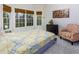 Bright bedroom with large windows, comfortable seating, and neutral decor at 3799 Halisport Nw Ln, Kennesaw, GA 30152