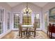 Bright breakfast room with a round table, hardwood floors, and large windows at 3799 Halisport Nw Ln, Kennesaw, GA 30152