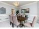 Formal dining room with chandelier and built-in hutch at 3799 Halisport Nw Ln, Kennesaw, GA 30152