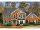 Two story brick home with green shutters at 3799 Halisport Nw Ln, Kennesaw, GA 30152