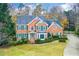 Two-story brick home with a landscaped yard at 3799 Halisport Nw Ln, Kennesaw, GA 30152