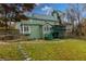 Green house exterior with deck, screened porch and landscaped yard at 3799 Halisport Nw Ln, Kennesaw, GA 30152