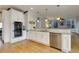 Modern kitchen with white cabinets, granite countertops, and stainless steel appliances at 3799 Halisport Nw Ln, Kennesaw, GA 30152