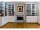 Built-in bookshelves flank a marble fireplace in this charming library at 3799 Halisport Nw Ln, Kennesaw, GA 30152