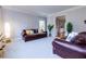 Living room with leather sofas and built-in shelving at 3799 Halisport Nw Ln, Kennesaw, GA 30152