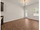 Bright dining room with hardwood floors and access to the backyard at 757 Galveston Way, Mcdonough, GA 30253