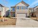 Two-story house with brick and siding exterior, two-car garage, and landscaping at 757 Galveston Way, Mcdonough, GA 30253