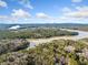 Expansive aerial view of a lake surrounded by lush forests, showcasing the natural beauty of the area at 10 Moss Landing Se Rd, Acworth, GA 30102