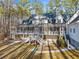 Large home with a spacious deck, expansive backyard and mature trees at 10 Moss Landing Se Rd, Acworth, GA 30102