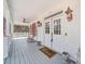 Inviting covered front porch with a ceiling fan and ample space for enjoying the outdoors at 10 Moss Landing Se Rd, Acworth, GA 30102