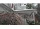 Front porch detail, snow-covered, with icicles hanging from trees nearby at 10 Moss Landing Se Rd, Acworth, GA 30102