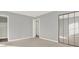 Bedroom with gray walls, mirrored closet and carpet at 373 Oak Harbor Trl, Marietta, GA 30066