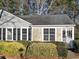 Gray house with stone accents and manicured bushes at 373 Oak Harbor Trl, Marietta, GA 30066