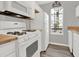 Bright kitchen with white cabinets, wood countertops, and gas range at 373 Oak Harbor Trl, Marietta, GA 30066