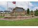 Auburn Ridge community entrance with stone signage and landscaping at 8218 Tiger Way, Riverdale, GA 30296