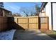 Driveway and double wooden gates leading to backyard at 2185 Fairfield St, Smyrna, GA 30080