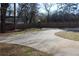 Large backyard with a wooden fence and a long driveway at 2185 Fairfield St, Smyrna, GA 30080