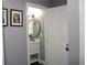 Modern bathroom with white vanity, round mirror, and stylish fixtures at 2185 Fairfield St, Smyrna, GA 30080