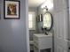 Updated bathroom with white vanity and a large mirror at 2185 Fairfield St, Smyrna, GA 30080