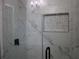 Modern bathroom with marble tile shower and glass enclosure at 2185 Fairfield St, Smyrna, GA 30080