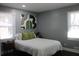 Cozy bedroom with a bed and green pillows at 2185 Fairfield St, Smyrna, GA 30080