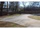 Long driveway with a wooden fence and a spacious yard at 2185 Fairfield St, Smyrna, GA 30080