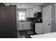 Modern kitchen with white cabinets and dark hardwood floors at 2185 Fairfield St, Smyrna, GA 30080