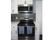 Stainless steel range and microwave in a modern kitchen setting at 2185 Fairfield St, Smyrna, GA 30080