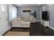 Living room with L-shaped sofa and dark hardwood floors at 2185 Fairfield St, Smyrna, GA 30080