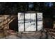 White storage shed in backyard with wooden fence at 2185 Fairfield St, Smyrna, GA 30080