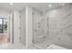 Bathroom featuring a walk-in shower with marble tile and glass enclosure at 2425 Peachtree Ne Rd # 701, Atlanta, GA 30305