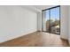 Bright bedroom with hardwood floors and window with city views at 2425 Peachtree Ne Rd # 701, Atlanta, GA 30305