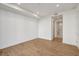 Empty bedroom with hardwood floors and an open doorway to the bathroom at 2425 Peachtree Ne Rd # 701, Atlanta, GA 30305