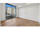 Bright bedroom with hardwood floors and large window offering city views at 2425 Peachtree Ne Rd # 701, Atlanta, GA 30305