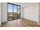 Light-filled bedroom with hardwood floors and expansive window views at 2425 Peachtree Ne Rd # 701, Atlanta, GA 30305