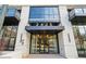 Modern building entrance with glass doors and stylish canopy at 2425 Peachtree Ne Rd # 701, Atlanta, GA 30305