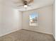 Bedroom with ceiling fan, window, and neutral wall at 412 Vermeer Ct, Locust Grove, GA 30248