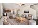 Inviting living room showcases wood floors, neutral paint, and an open floor plan to the kitchen at 412 Vermeer Ct, Locust Grove, GA 30248