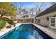 Back exterior view of pool and patio area, plus back facade of home at 1134 Ferncliff Ne Rd, Atlanta, GA 30324