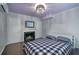 Cozy bedroom with fireplace, hardwood floors, and built-in shelving at 5400 Roswell Rd # P2, Atlanta, GA 30342