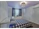 Spacious bedroom with hardwood floors and a modern chandelier at 5400 Roswell Rd # P2, Atlanta, GA 30342