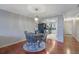 Bright dining area with hardwood floors and a charming table set for four at 5400 Roswell Rd # P2, Atlanta, GA 30342