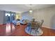 Bright dining area with hardwood floors and chandelier at 5400 Roswell Rd # P2, Atlanta, GA 30342
