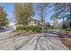 Exterior of building complex with driveway and landscaping at 5400 Roswell Rd # P2, Atlanta, GA 30342