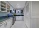 Modern kitchen with white cabinets, green countertops, and stainless steel appliances at 5400 Roswell Rd # P2, Atlanta, GA 30342